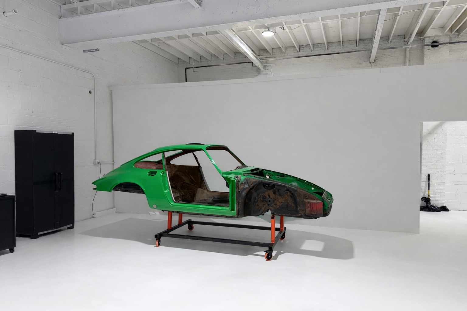 Porsche 911 shell mid-restoration at Oakwood Automotive studio, Raleigh NC